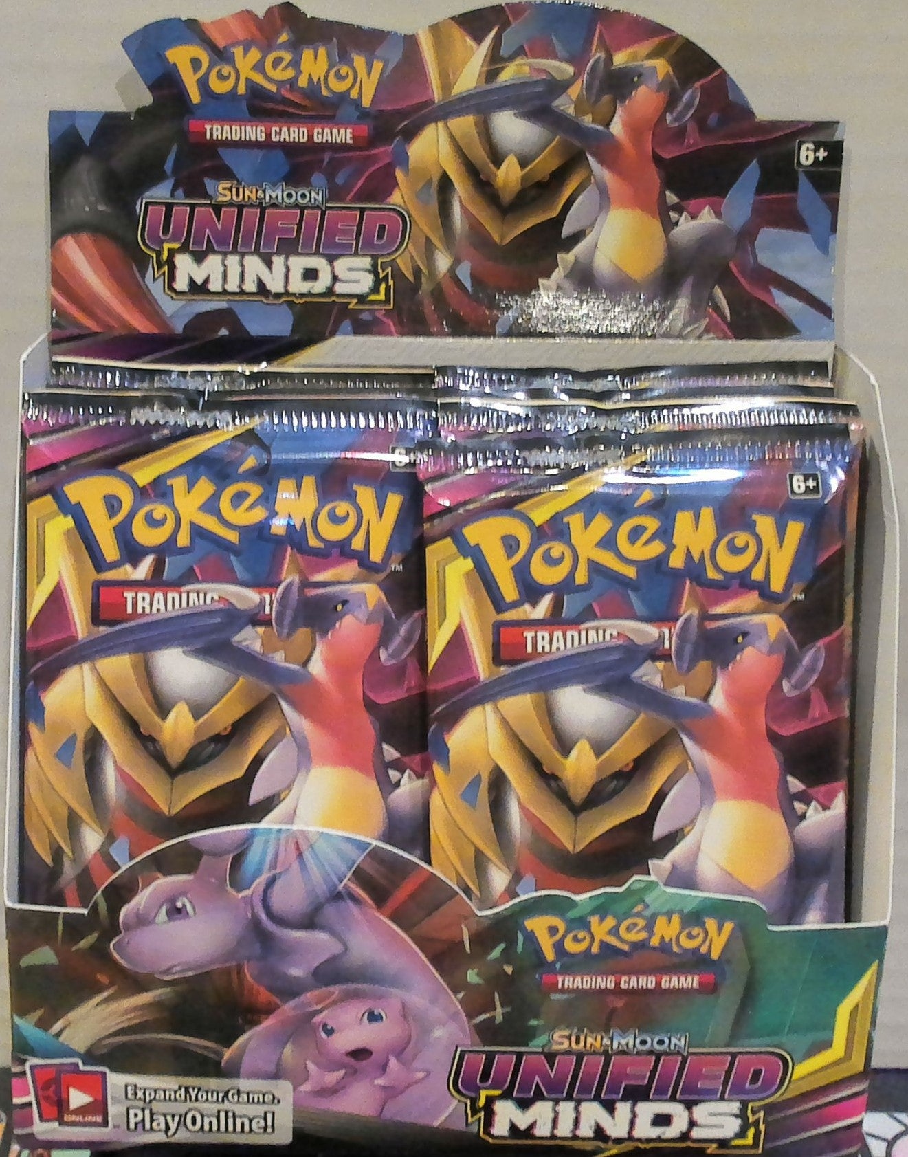 Sun & Moon Unified Minds booster pack box